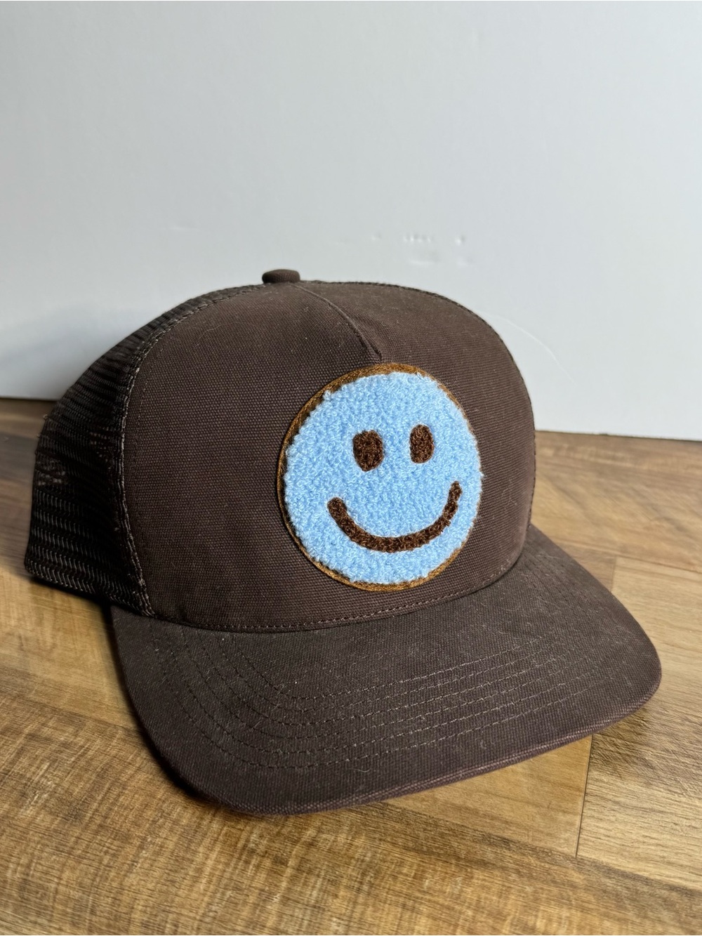 Brown Trucker Hat with Light Blue Smiley Patch